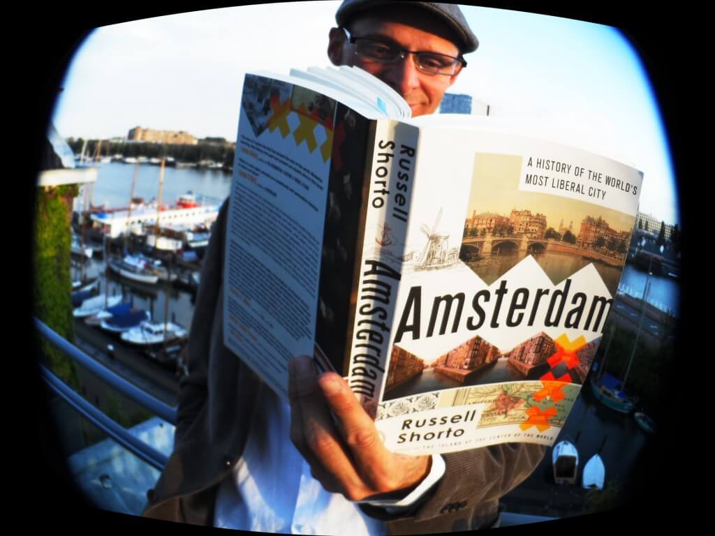 Mark reading Russell Shorto's book about Amsterdam