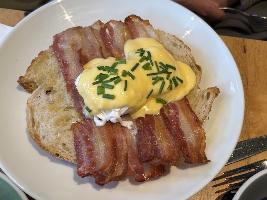 Eggs Benny - poached eggs with crispy bacon and hollondaise sauce