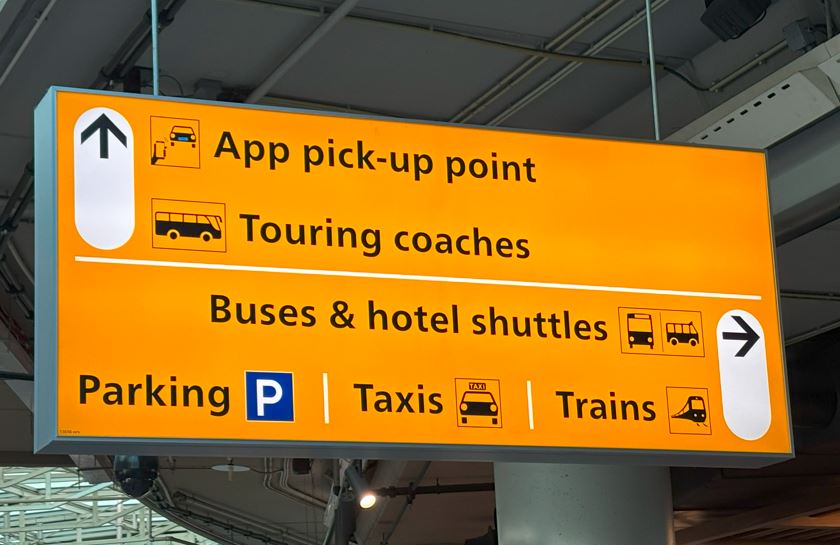 Sign to Uber pcik up point at Schipol Airport
