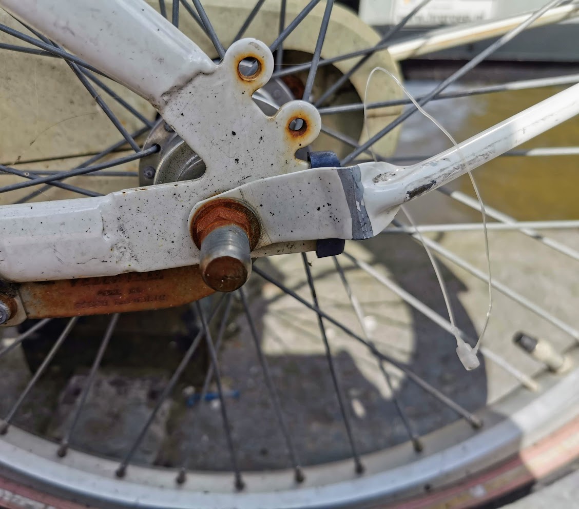 Abandoned bycycle on a canal bridge